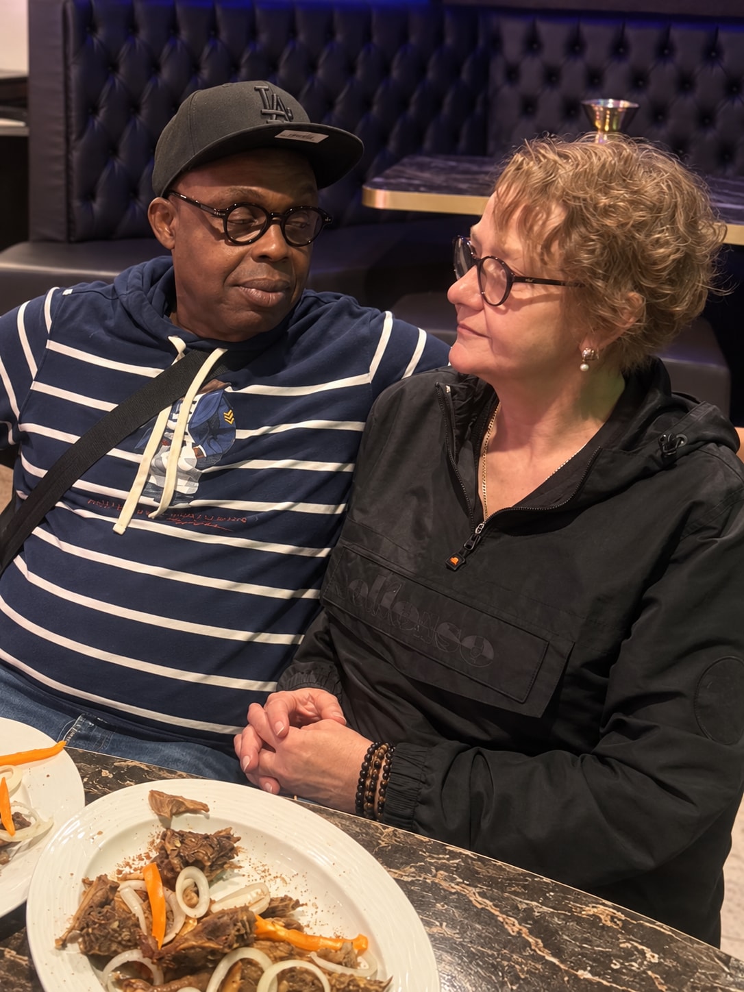 Bobby and Sylvia together at a table