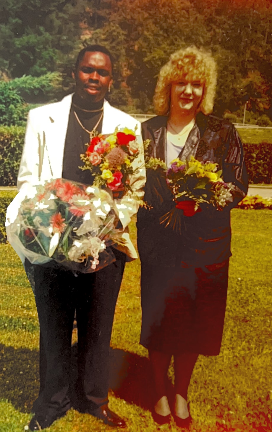 Bobby and Sylvia holding flowers